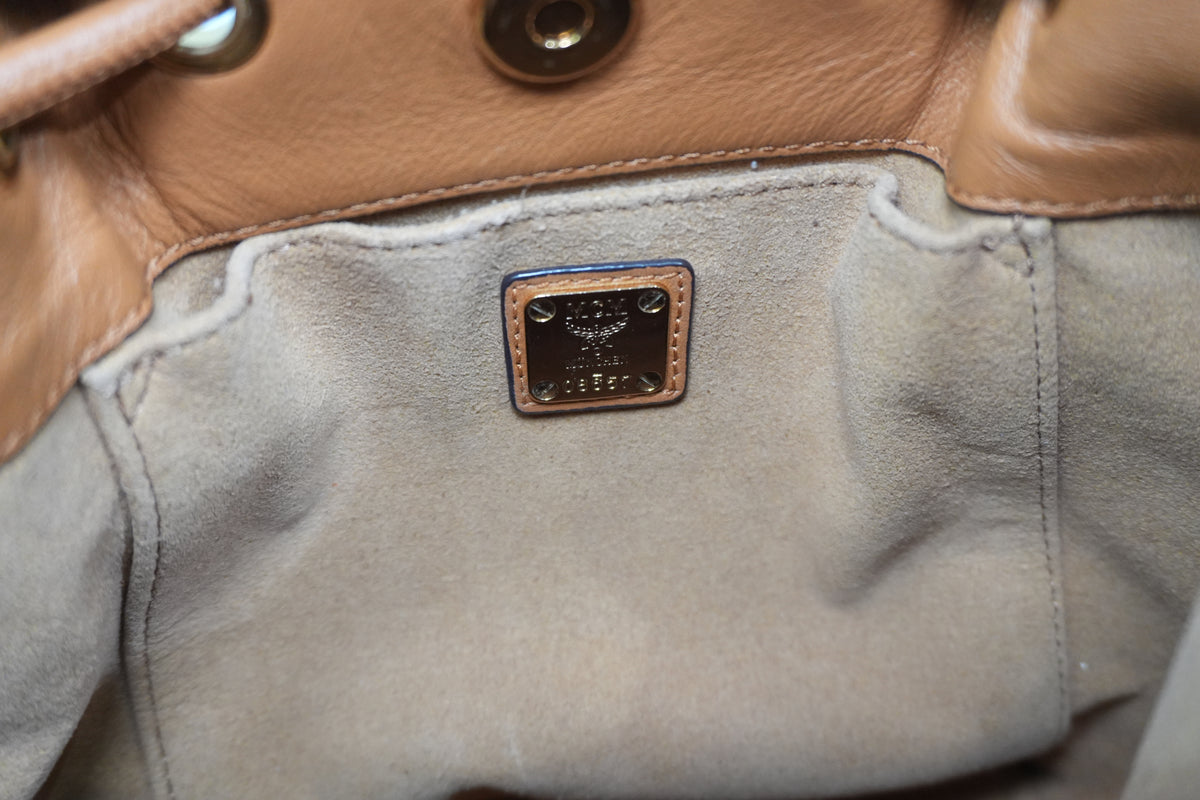 Pre-Owned MCM Park Rabbit Visetos Drawstring Crossbody bag Cognac