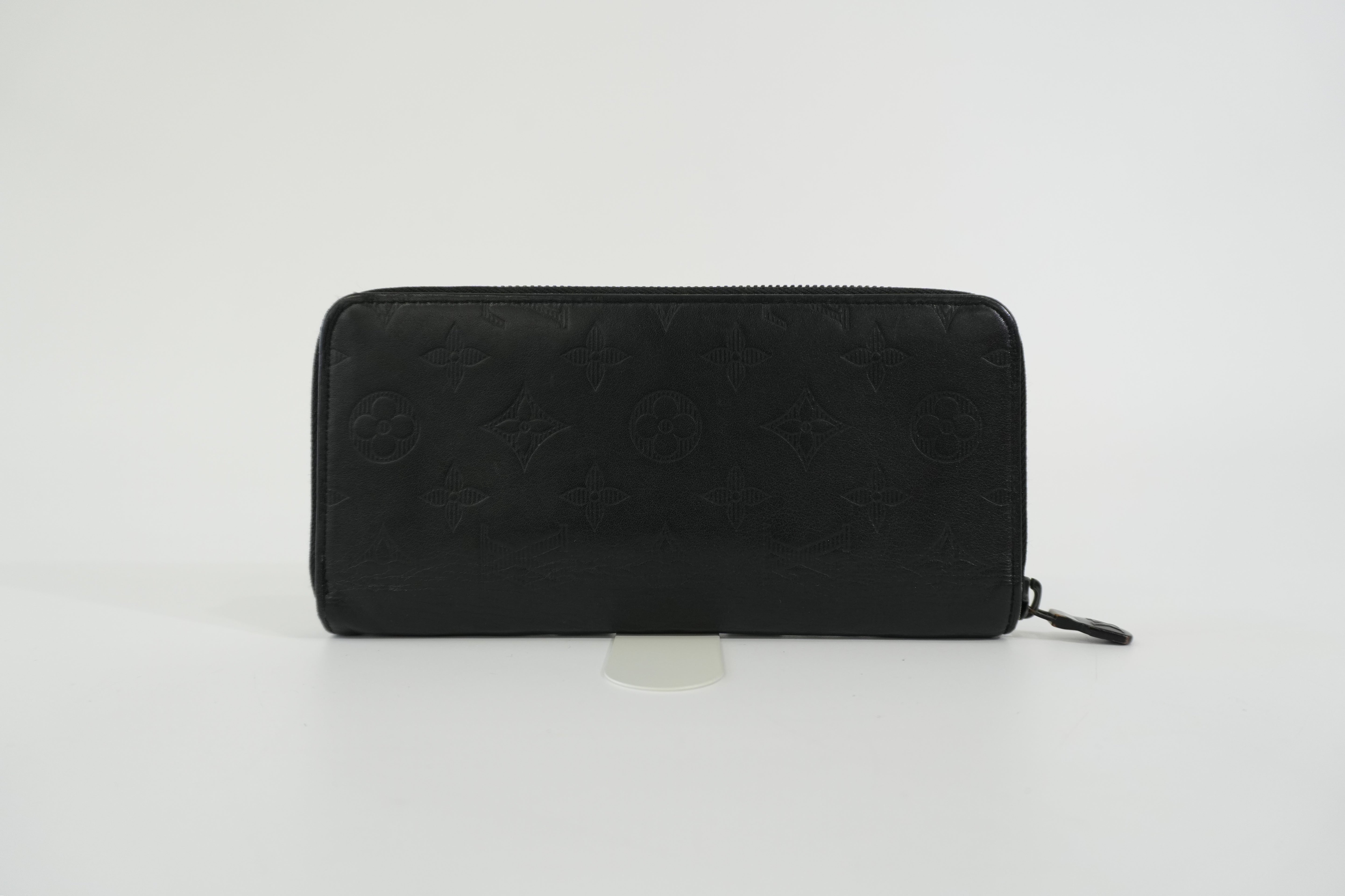 Pre-owned Louis Vuitton Shadow Monogram Vertical Zippy Wallet Black