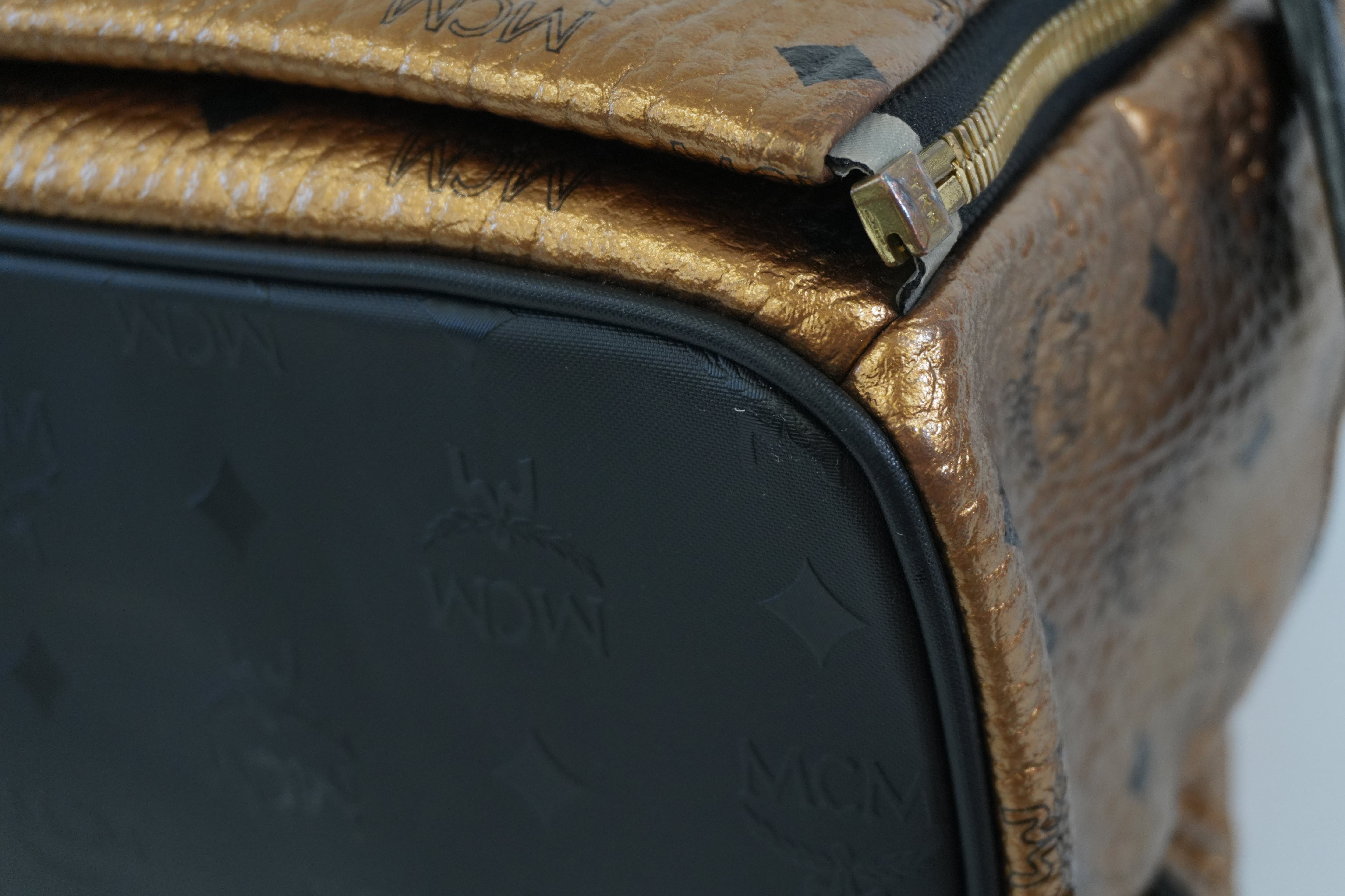 Pre-owned MCM Metallic Backpack with Detachable Pouch Gold