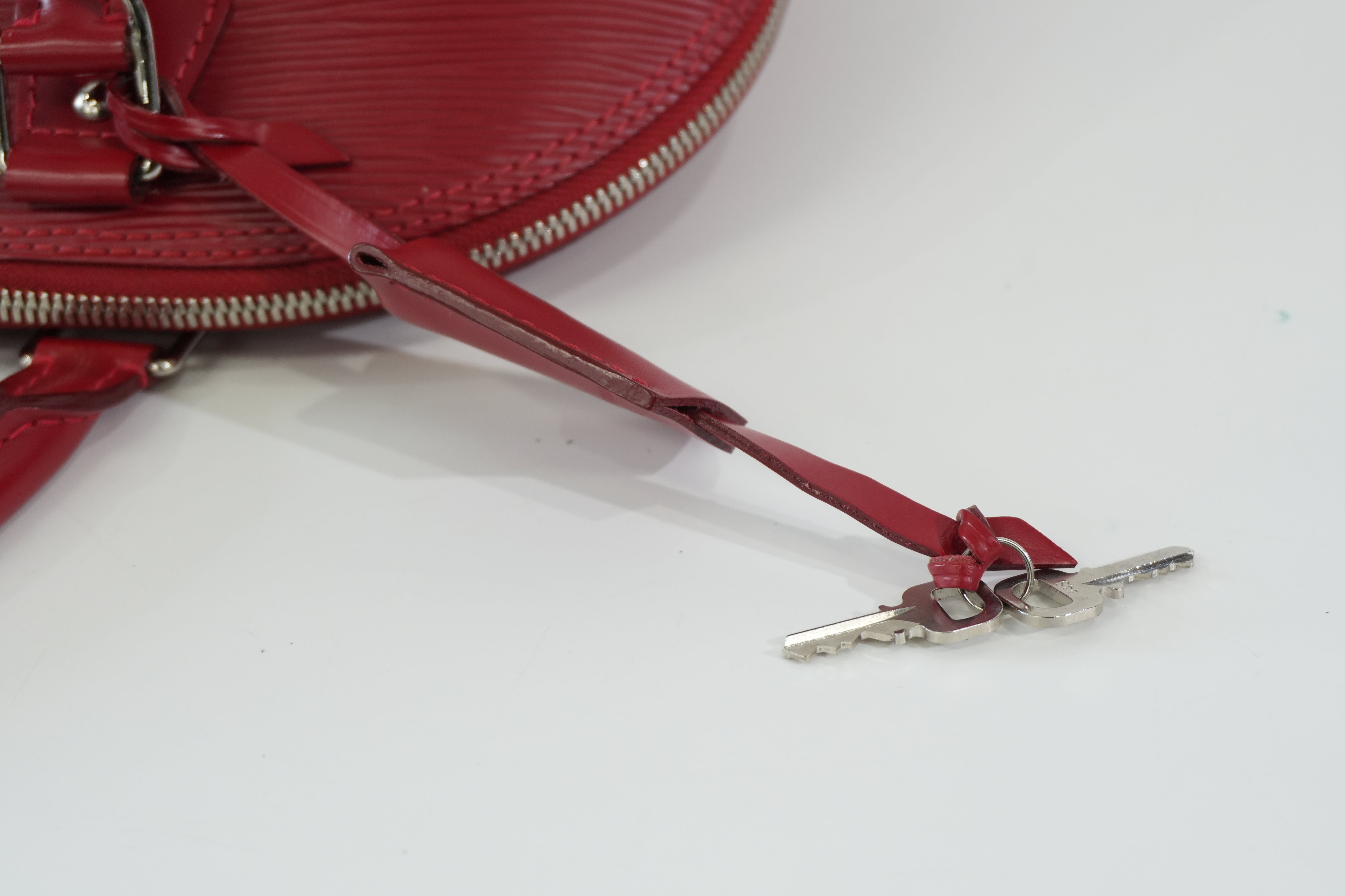 Pre-owned Louis Vuitton Epi Alma PM Handbag Red